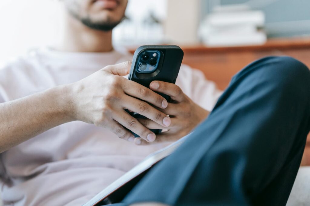 a man checking his girlfriend's phone