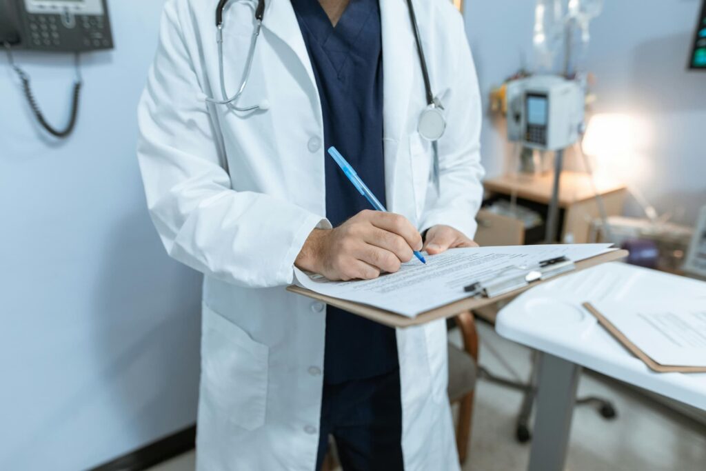 doctor examining a patient's medical card